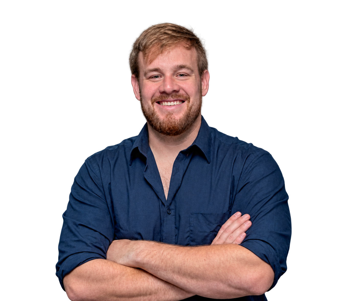 Des Brown smiling with his arms folded